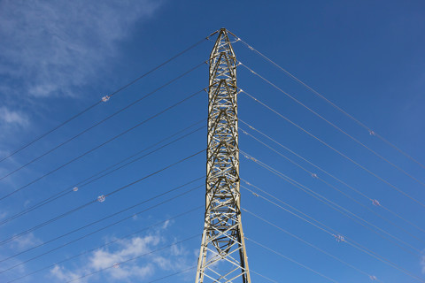 High voltage towers with sky background