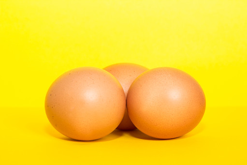Eggs on yellow background